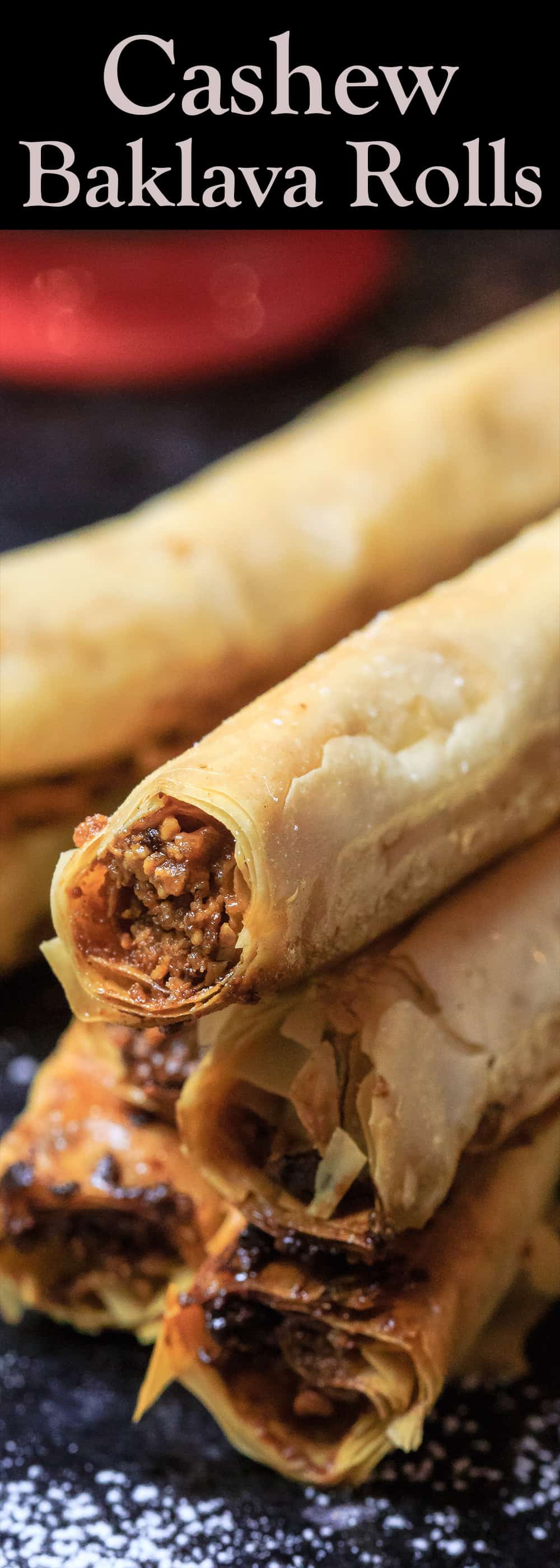 Cashew Filled Baklava Rolls | The Mediterranean Dish. A unique and simple Baklava recipe perfect for entertaining. Perfectly crispy phyllo rolls filled with a tasty cashew mixture and drenched in a lemon simple syrup. See the easy step-by-step tutorial and recipe on TheMediterraneanDish.com #baklava #dessert #pastry #phyllo #baklavarecipe #phyllorecipe #fillo #greekrecipe #turkishrecipe #holidaydessert #fingerfood #partyfood #thanksgiving #christmasdessert #christmas #christmasdinner #christmasbrunch