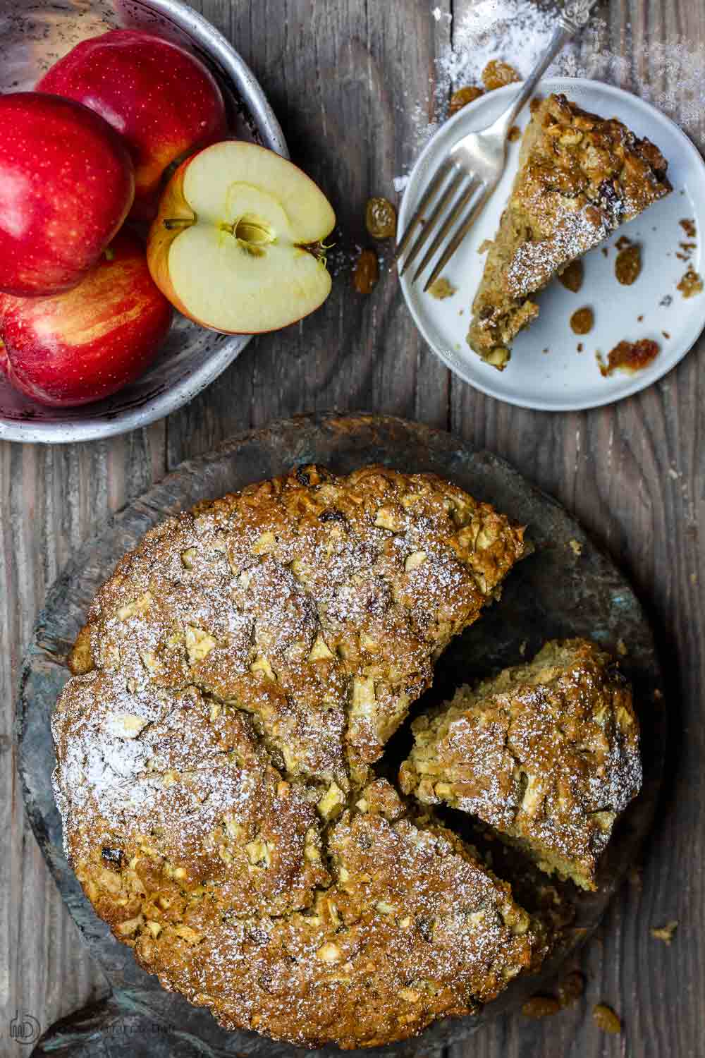 Apple Olive Oil Cake Sliced. A slice served on plate to the side