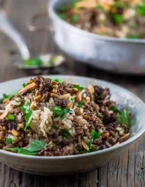 Lebanese Rice (Hashweh) | The Mediterranean Dish. Easy, flavorful loaded Lebanese Rice with ground beef, toasted nuts, raisins and sweet, earthy spices. Makes the perfect side dish or dinner bowl. Think also gluten free stuffing! #rice #lebaneserice #middleeasternrice #lebaneserecipe #mediterraneanrecipe