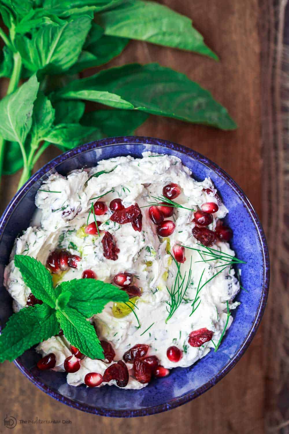 Labneh garnished with pomegranate seeds and fresh mint