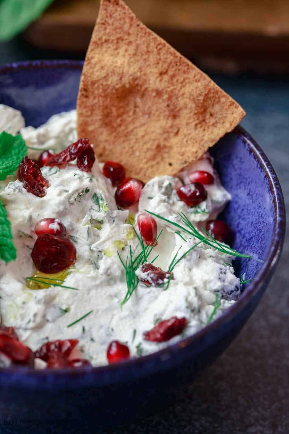 Close-up of Cranberry and Herb Labneh Recipe with pita chips