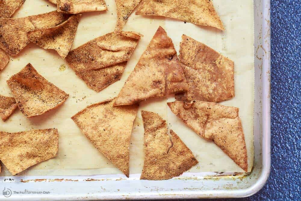 Baked pita chips on baking sheet