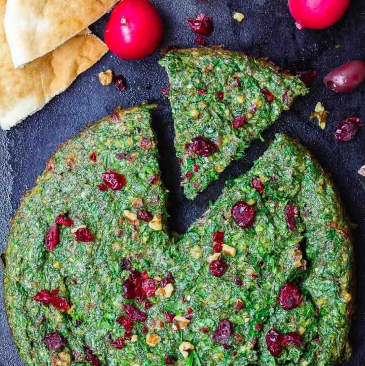 Kuku Sabzi: Persian Herb Baked Omelet | The Mediterranean Dish. Light, herby, flavor-packed Persian baked omelet or frittata with tons of fresh herbs and beautiful spices that will have you coming for more. Perfect for your next special brunch! Get the full recipe on TheMediterraneanDish.com #eggs #breakfast #christmasbrunch #bakedomelet #frittata #mediterraneanrecipe #persianrecipe #kukusabzi