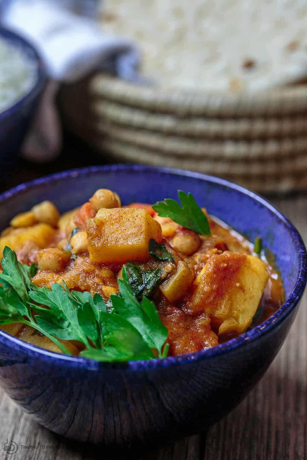 Moroccan Vegetable Tagine Recipe | The Mediterranean Dish. A simple and succulent vegetable stew, flavored Morrocan-style with warm spices, aromatics, and dried apricots. The best vegetable tagine or vegetable stew you'll have. See it on TheMediterraneanDish.com #vegetablestew #tagine #mediterraneanfood #moroccanfood #veganrecipe #onepot