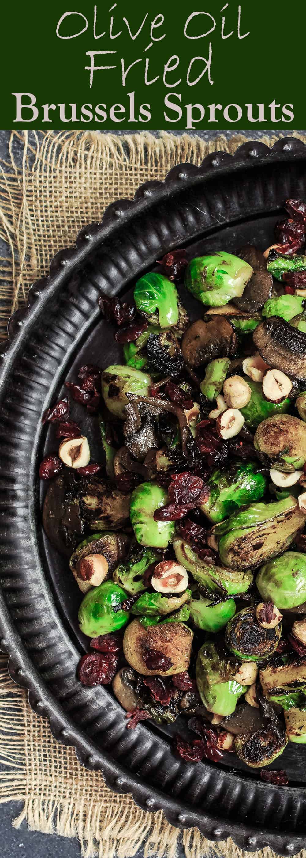 Olive Oil Fried Brussels Sprouts | The Mediterranean Dish. Simple olive oil fried sprouts with mushrooms, cranberries, and hazelnuts, makes a festive vegan and gluten free side dish. See full recipe on TheMediterraneanDish.com #mediterraneanrecipe #friedbrusselssprouts #brusselssprouts #thanskgivingdinner #holidaysidedish #sidedish