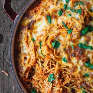 Baked Spaghetti Recipe | The Mediterranean Dish! A hearty baked spaghetti casserole with a lighter cheese mixture and the BEST homemade spaghetti sauce. Recipe on TheMediterraneanDish.com #spaghetti #bakedspaghetti #pasta #casserole