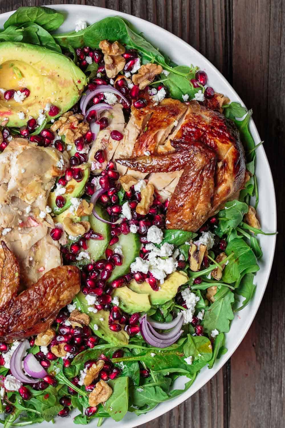 Chicken and avocado served on top of Arugula Salad