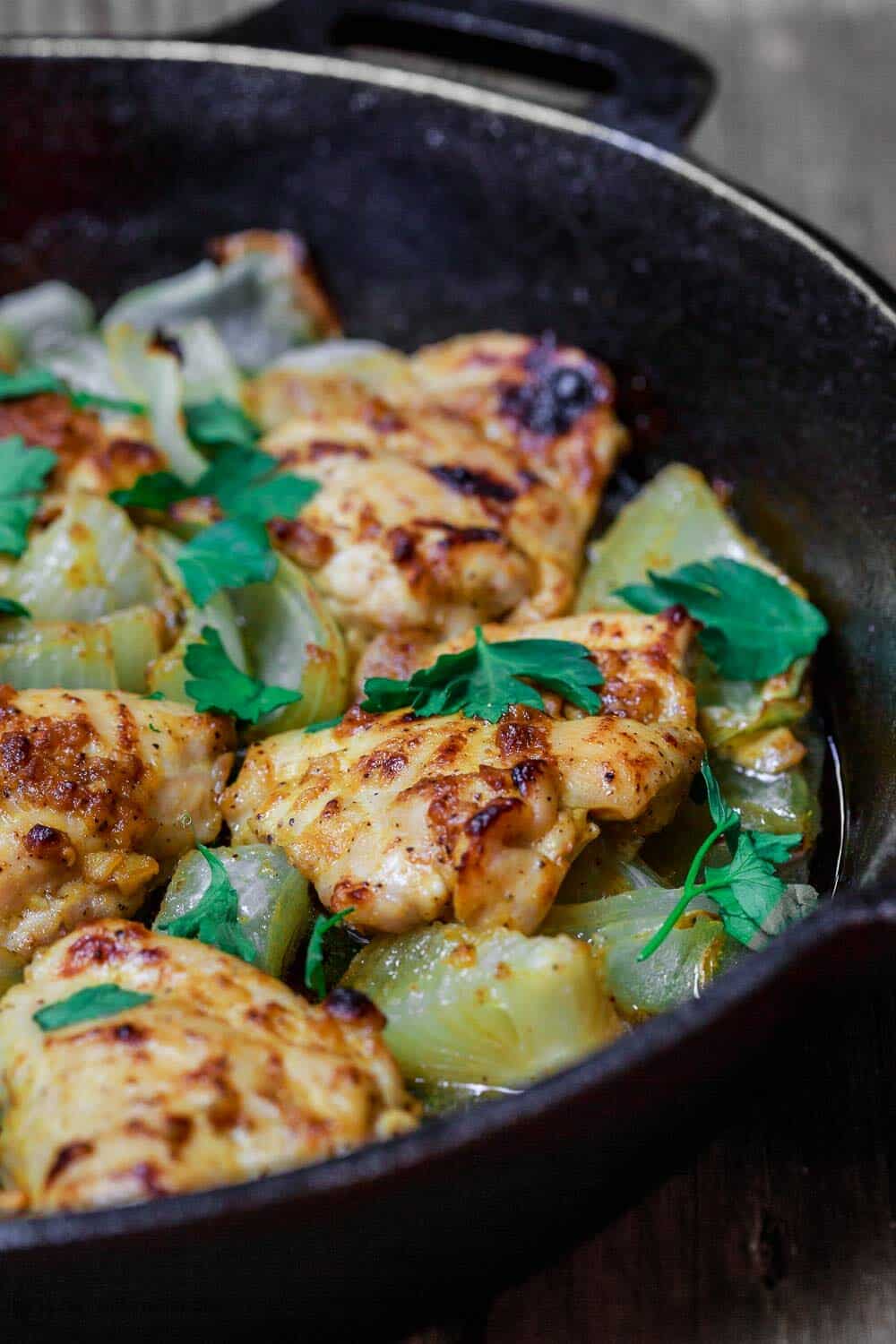 Close-up of skillet garlic Dijon Chicken cooking in a skillet