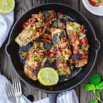Mediterranean Pan Seared Sea Bass Recipe | The Mediterranean Dish. Quick and crispy pan seared sea bass, coated with Mediterranean spices and a tasty bell pepper medley to serve on top or as a side! Dinner in minutes! from TheMediterraneanDish.com #mediterraneandiet #mediterraneanrecipes #seafoodrecipes #fish #fishrecipes #healthyrecipes #lowcarbrecipes #weeknightdinner #weeknightmeal #onpotdinner #onepan #glutenfreerecipes #seabass #easyrecipes