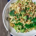 Simple, hearty Mediterranean bean and broccoli pasta. Tossed in olive oil, fresh parsley and favorite spices. A sprinkle of grated Parmesan and some toasted pine nuts seal the deal! See it on TheMediterraneanDish.com #pasta #pastadinner #mediterraneandiet #healthyrecipes #comfortfood #onepotpasta #onepot