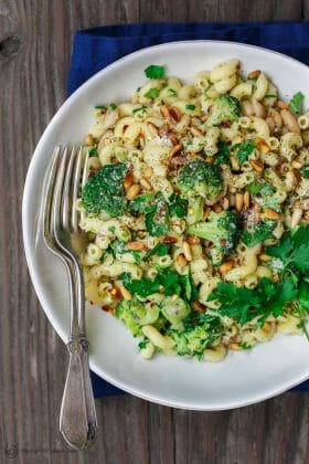 Simple, hearty Mediterranean bean and broccoli pasta. Tossed in olive oil, fresh parsley and favorite spices. A sprinkle of grated Parmesan and some toasted pine nuts seal the deal! See it on TheMediterraneanDish.com #pasta #pastadinner #mediterraneandiet #healthyrecipes #comfortfood #onepotpasta #onepot