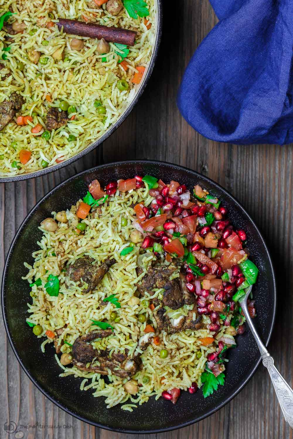 Middle Eastern Chicken and Rice | The Mediterranean Dish. Simple, comforting, one-pot chicken and rice dinner with a tasty Middle Eastern twist. Flavor heaven! Comes together in 30 minutes. Recipe from TheMediterraneanDish.com #mediterraneandiet #middleeasternfood #chickenthighs #onepot #easydinner #healthyrecipes #glutenfree