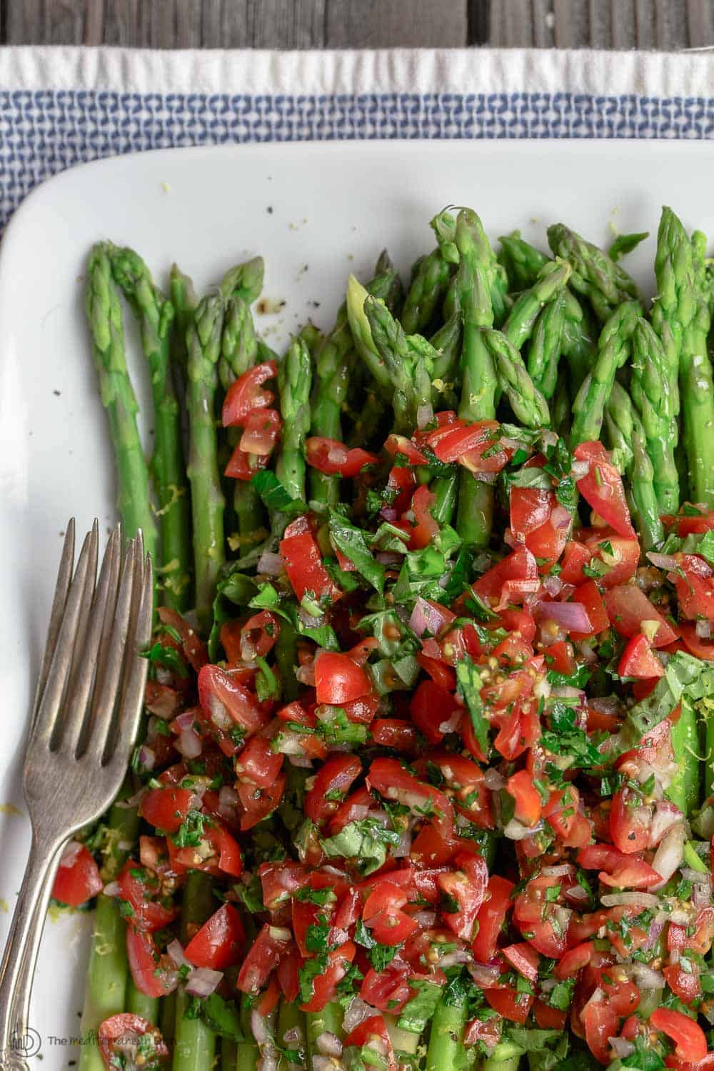 Blanched asparagus, topped with Mediterranean salsa.