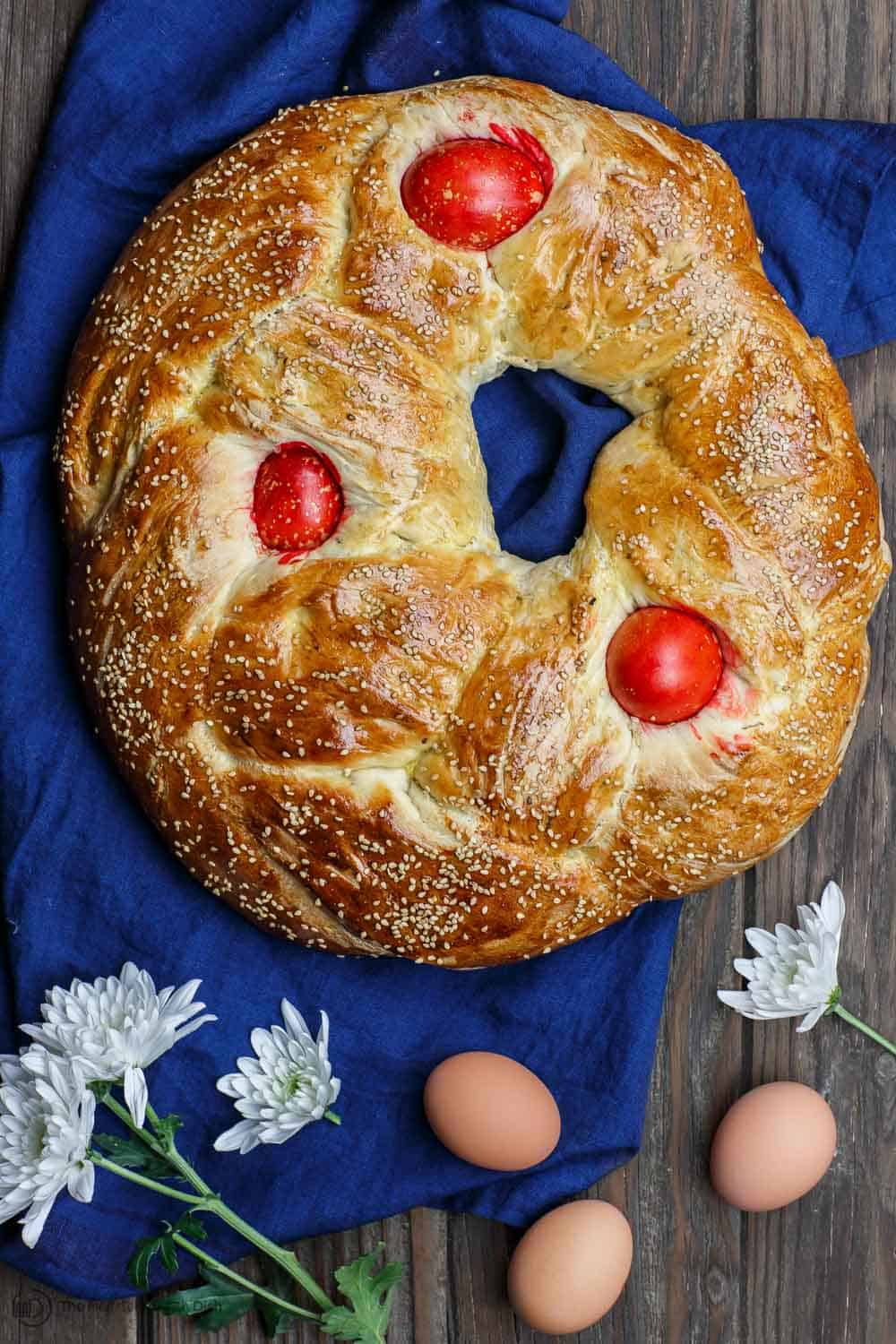 Crispy crust of Greek Easter Bread dusted with sesame seeds