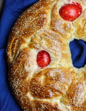 Greek Easter Bread Recipe | The Mediterranean Dish. Easy Easter bread recipe for sweet, brioche-like Easter bread with a Greek twist. Tasty, dense bread that's adorned with red eggs. Recipe from TheMediterraneanDish.com #bread #baking #easterbread #easterrecipes #mediterranean #greekfood #greekrecipe