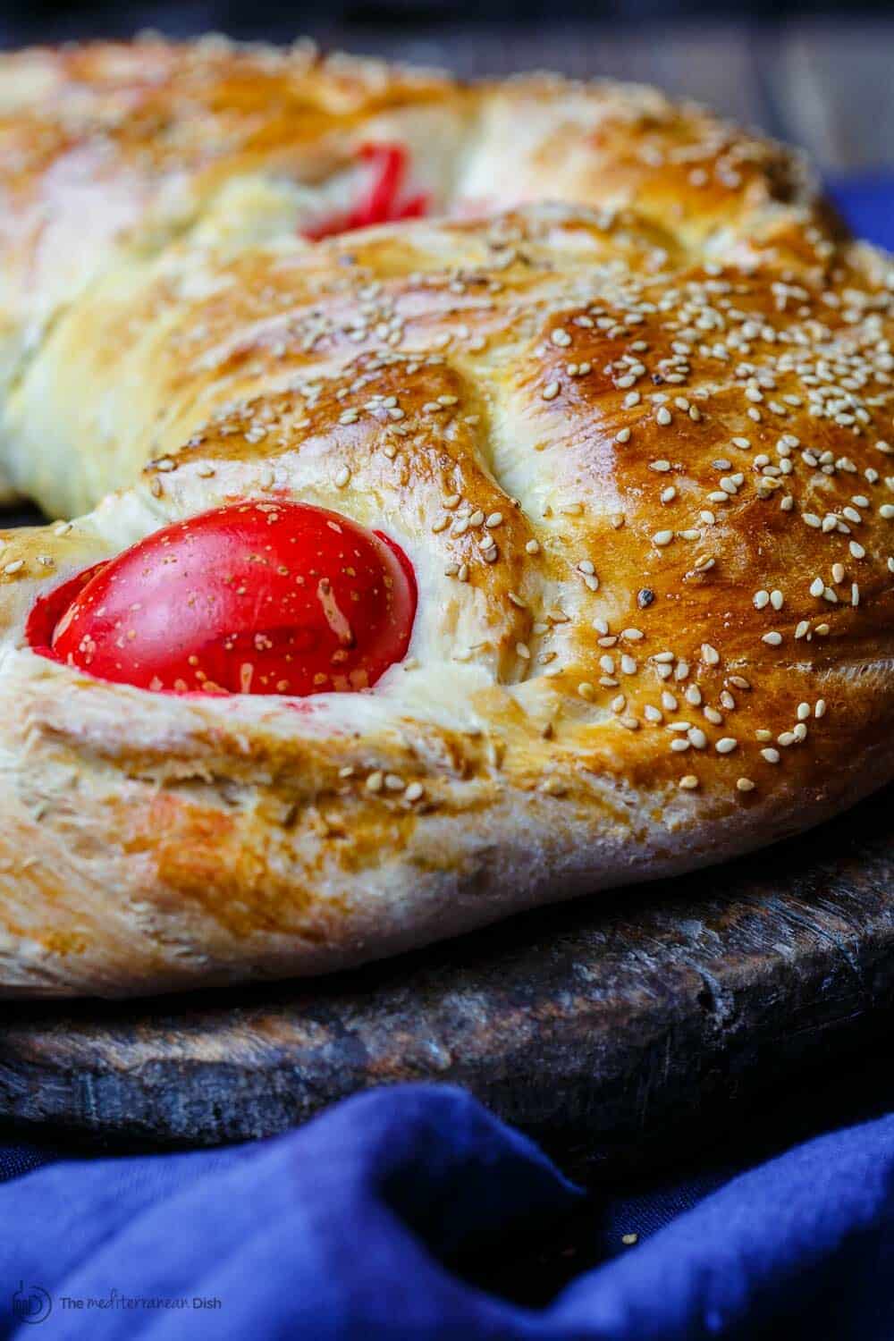 Close-up of dyed hard boiled egg in crust of Greek Easter Bread 