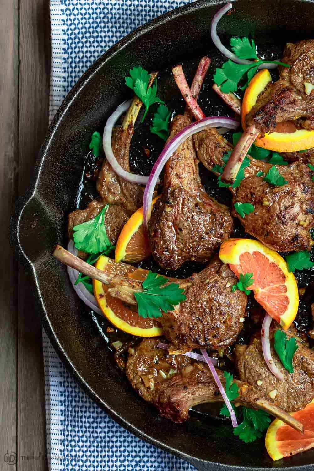 Lamb Chops with Harissa Spice Rub and Orange in Cast Iron Skillet