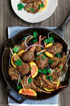 Orange Harissa Lamb Chops Recipe | The Mediterranean Dish. Quick pan-seared and flavor-packed lamb chops with a special Mediterranean spice rub and an orange-garlic marinade. So little work goes into these lamb chops, but they are the BEST! See them on TheMediterraneanDish.com #lamb #lambchops #Mediterraneanfood #moroccanfood #easyrecipe #onepan #onpot #mediterraneandiet #meat