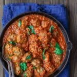 Lebanese-Style Meatballs Recipe in Tomato Sauce | The Mediterranean Dish. Juicy, tender meatballs, prepared Lebanese-style with notes of cinnamon and allspice, then braised in a tasty, thick tomato sauce. A couple simple ingredients take this meatballs recipe over the top. From TheMediterraneanDish.com #easyrecipe #meatballs #mediterraneanrecipe #mediterraneandiet #lebanese #meatballsrecipe #onepot