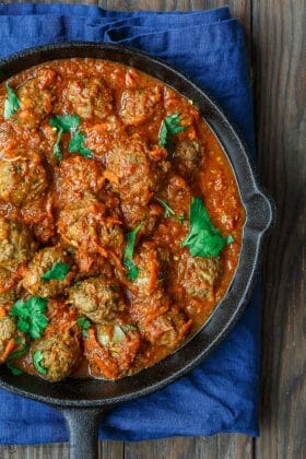 Lebanese-Style Meatballs Recipe in Tomato Sauce | The Mediterranean Dish. Juicy, tender meatballs, prepared Lebanese-style with notes of cinnamon and allspice, then braised in a tasty, thick tomato sauce. A couple simple ingredients take this meatballs recipe over the top. From TheMediterraneanDish.com #easyrecipe #meatballs #mediterraneanrecipe #mediterraneandiet #lebanese #meatballsrecipe #onepot