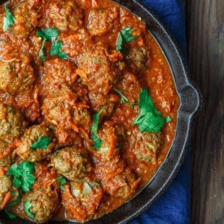 Lebanese-Style Meatballs Recipe in Tomato Sauce | The Mediterranean Dish. Juicy, tender meatballs, prepared Lebanese-style with notes of cinnamon and allspice, then braised in a tasty, thick tomato sauce. A couple simple ingredients take this meatballs recipe over the top. From TheMediterraneanDish.com #easyrecipe #meatballs #mediterraneanrecipe #mediterraneandiet #lebanese #meatballsrecipe #onepot