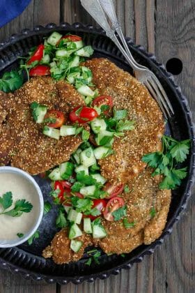 Za'atar Breaded Chicken Recipe | The Mediterranean Dish. Best breaded chicken you'll ever have! Chicken cutlets are prepared to tender perfection and given a golden, perfectly crispy breading with za'atar and toasted sesame seed. See our suggestions for sides and salads. Recipe from TheMediterraneanDish.com #chickenrecipes #breadedchicken #chickendinner #mediterraneanfood #30minutemeal #chicken