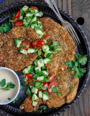 Za'atar Breaded Chicken Recipe | The Mediterranean Dish. Best breaded chicken you'll ever have! Chicken cutlets are prepared to tender perfection and given a golden, perfectly crispy breading with za'atar and toasted sesame seed. See our suggestions for sides and salads. Recipe from TheMediterraneanDish.com #chickenrecipes #breadedchicken #chickendinner #mediterraneanfood #30minutemeal #chicken