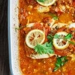 Mediterranean Baked Fish Recipe with Tomatoes and Capers | The Mediterranean Dish. Easy, bright, flavor-packed baked fish, prepared Mediterranean style with spices, tomatoes and capers. From TheMediterraneanDish.com #healthyrecipes #fishrecipe #bakedfish #cod #halibut #glutenfree #seafoodrecipe #seafood #fish #mediterraneandiet #mediterranean #easyrecipe