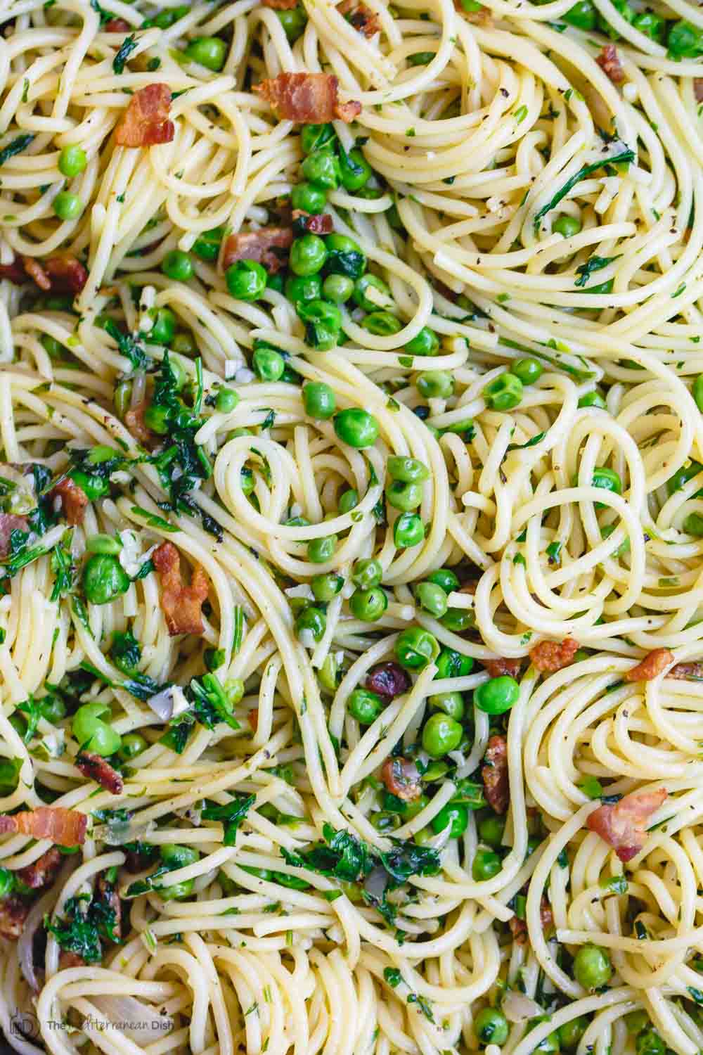 Pasta with pancetta and peas close up shot