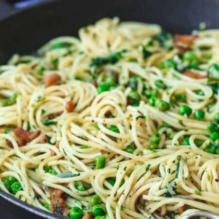 pancetta pasta with peas in a cast iron skillet