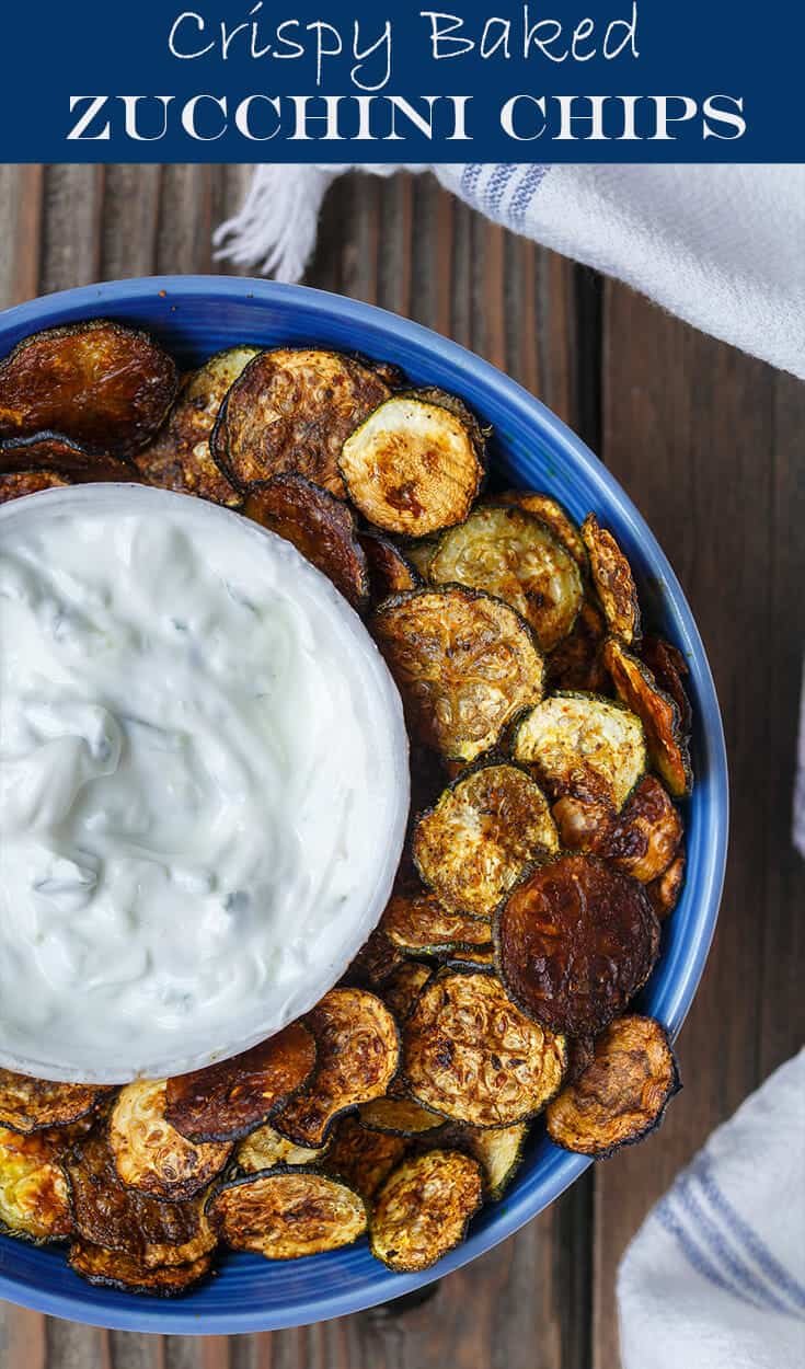 Baked Zucchini Chips Recipe | The Mediterranean Dish. Get my tips for how to make perfectly crispy baked zucchini chips! Tasty, healthy, low-calorie snack that everyone loves. From TheMediterraneanDish.com