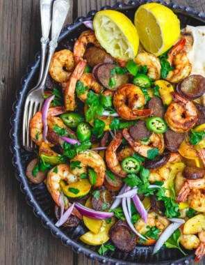 Skillet Shrimp Recipe with Chorizo and Squash | The Mediterranean Dish. Easy recipe for Spanish inspired skillet shrimp with flavors like smoked paprika and cumin. We add Spanish Chorizo and summer squash to complete the feast! Cooks in 20 minutes! From TheMediterraneanDish.com