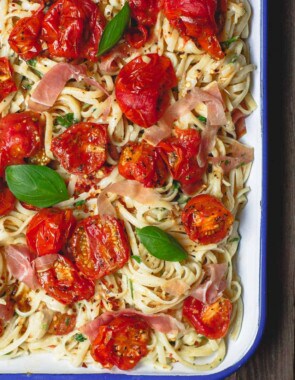 Carbonara Recipe with Roasted Tomatoes | The Mediterranean Dish. A lighter, and flavor-packed cabornara recipes with garlic roasted tomatoes and fresh herbs. You can add ribbons of prosciutto, if you like. A couple of tricks make a perfectly creamy carbonara. Recipe from themediterraneandish.com #pasta #pastarecipe #italianfood #mediterraneandiet #carbonara #easyrecipe