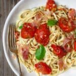 Carbonara Recipe with Roasted Tomatoes | The Mediterranean Dish. A lighter, and flavor-packed cabornara recipes with garlic roasted tomatoes and fresh herbs. You can add ribbons of prosciutto, if you like. A couple of tricks make a perfectly creamy carbonara. Recipe from themediterraneandish.com #pasta #pastarecipe #italianfood #mediterraneandiet #carbonara #easyrecipe