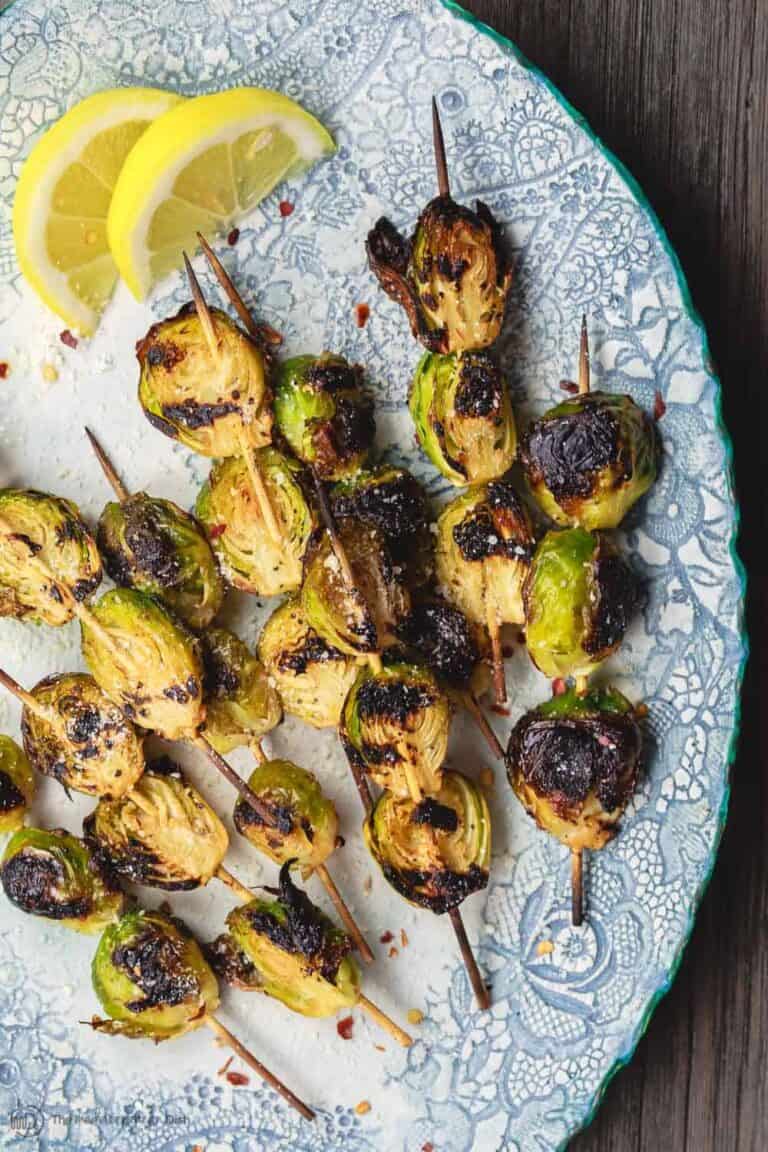 Grilled Brussels Sprouts Skewers | The Mediterranean Dish. Easy, flavor-packed burssels sprouts. Marinated, Mediterranean style, then charred to perfection and finished with Parmesan cheese. Recipe from themediterraneandish.com