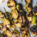 Grilled Brussels Sprouts Skewers | The Mediterranean Dish. Easy, flavor-packed burssels sprouts. Marinated, Mediterranean style, then charred to perfection and finished with Parmesan cheese. Recipe from themediterraneandish.com