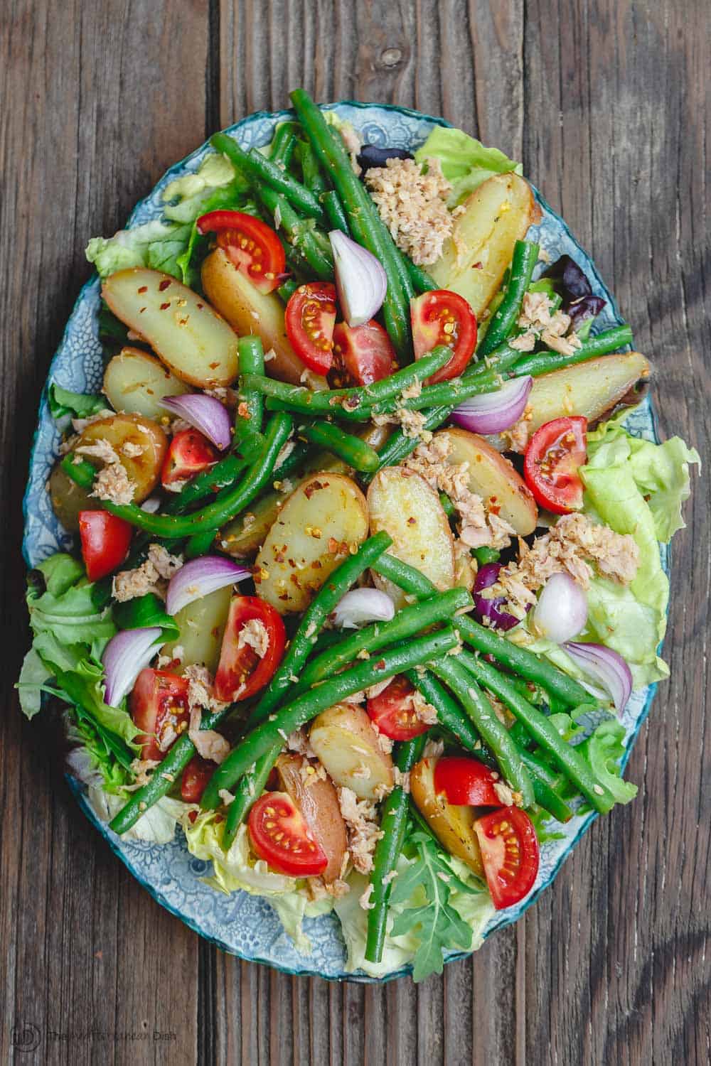 Spanish Potato Salad Recipe with Tuna | The Mediterranean Dish. Easy, tasty potato salad with tuna, green beans, and tomatoes. Lots of flavor from earthy spices and a simple Spanish-inspired dressing. Great as an appetizer or a light dinner. Recipe from TheMediterraneanDish.com #mediterraneandiet #mediterraneansalad #spanishsalad #potatosalad #glutenfree #tunasalad #healthyrecipes #greenbeans