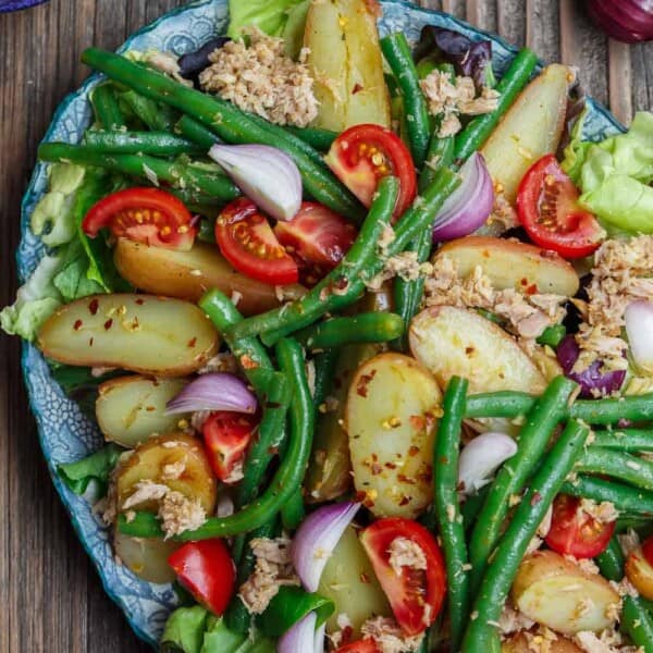Spanish Potato Salad Recipe with Tuna | The Mediterranean Dish. Easy, tasty potato salad with tuna, green beans, and tomatoes. Lots of flavor from earthy spices and a simple Spanish-inspired dressing. Great as an appetizer or a light dinner. Recipe from TheMediterraneanDish.com #mediterraneandiet #mediterraneansalad #spanishsalad #potatosalad #glutenfree #tunasalad #healthyrecipes #greenbeans