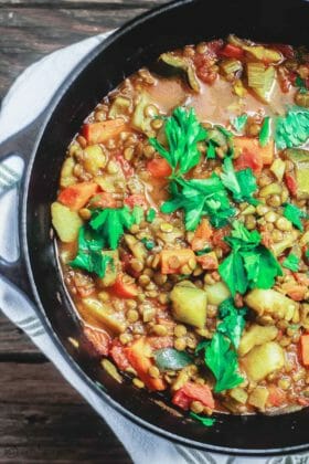 Chunky Vegan Lentil Soup Recipe | The Mediterranean Dish. Mediterranean style lentil soup with vegetables, warm spices, and fresh herbs. Anything but an ordinary lentil soup. Try this heart-warming, nutrition packed soup, and you'll be coming for more. Recipe via TheMediterraneanDish.com