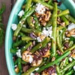 Greek Green Bean Salad Recipe | The Mediterranean Dish. Perfectly tender, flavor-packed green bean salad prepared Greek style. A garlicy, zesty dressing pulls it together, and a sprinkle of feta and chopped marinated olives take it to a new level of delicious. Get the easy recipe on themediterraneandish.com #greenbeans #greekfood #greekrecipe #mediterraneanrecipe #mediterraneandiet