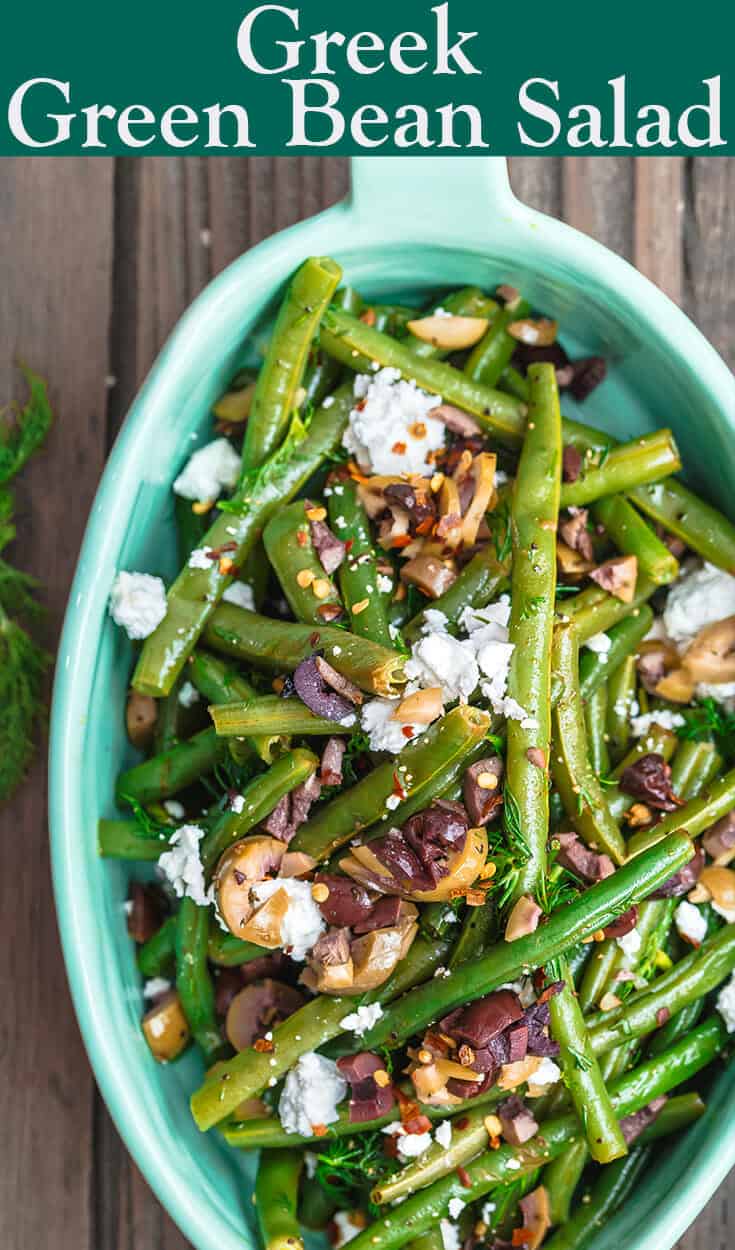 Greek Green Bean Salad Recipe | The Mediterranean Dish. Perfectly tender, flavor-packed green bean salad prepared Greek style. A garlicy, zesty dressing pulls it together, and a sprinkle of feta and chopped marinated olives take it to a new level of delicious. Get the easy recipe on themediterraneandish.com #greenbeans #greekfood #greekrecipe #mediterraneanrecipe #mediterraneandiet