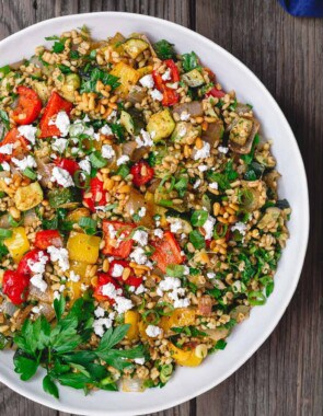 Mediterranean Roasted Vegetable Barley Recipe | The Mediterranean Dish. Easy, satisfying vegetarian barley recipe, prepared Mediterranean style. Tons of flavor from fresh herbs, spices and a simple zesty dressing. Perfect for meal prep. Recipe from TheMediterraneandish.com #barley #barleysalad #roastedvegetables #mediterraneandiet #mediterraneanfood