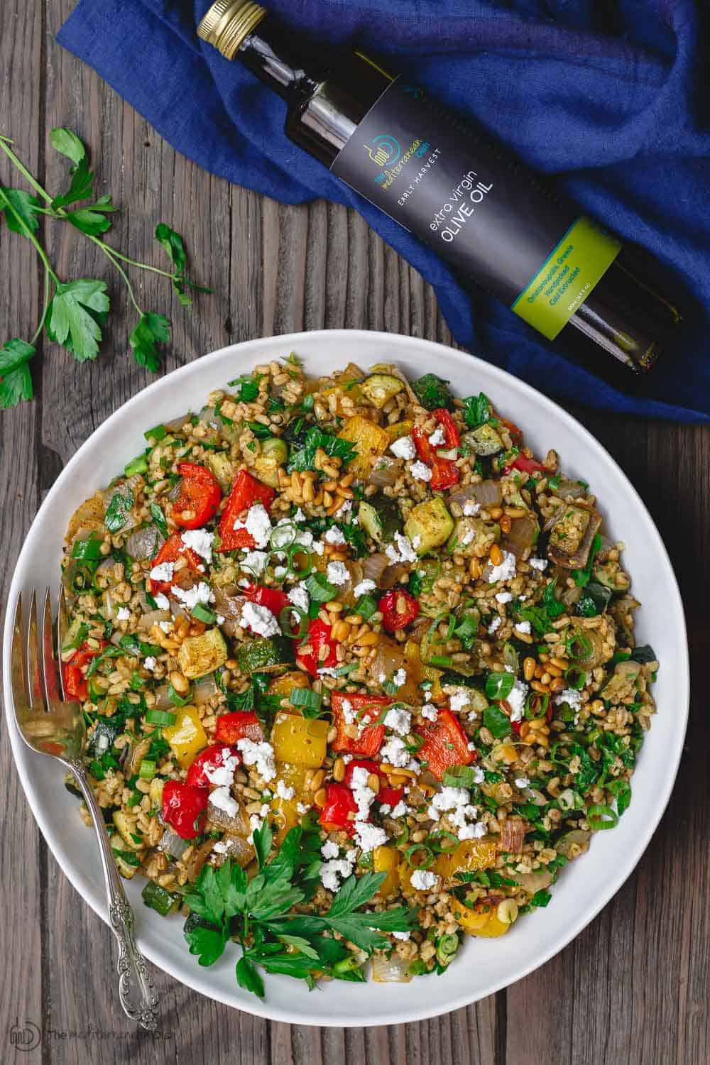Mediterranean Roasted Vegetable Barley Recipe | The Mediterranean Dish. Easy, satisfying vegetarian barley recipe, prepared Mediterranean style. Tons of flavor from fresh herbs, spices and a simple zesty dressing. Perfect for meal prep. Recipe from TheMediterraneandish.com #barley #barleysalad #roastedvegetables #mediterraneandiet #mediterraneanfood