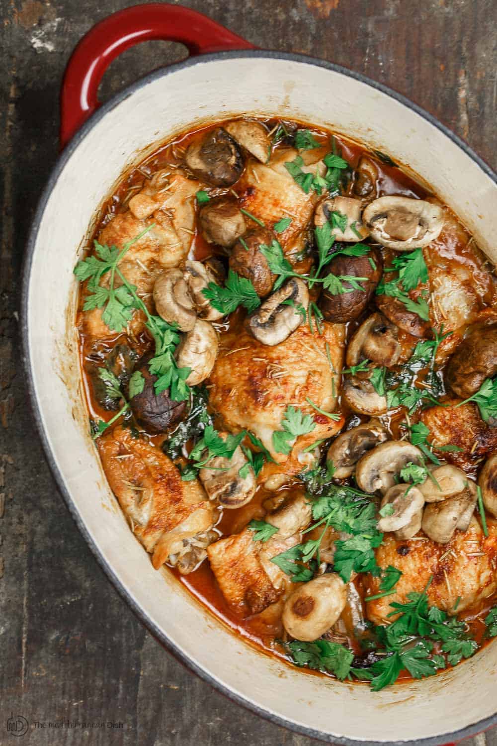 Wine-Braised Chicken Thighs, prepared Mediterranean-style with a rosemary spice rub, shallots, and mushrooms