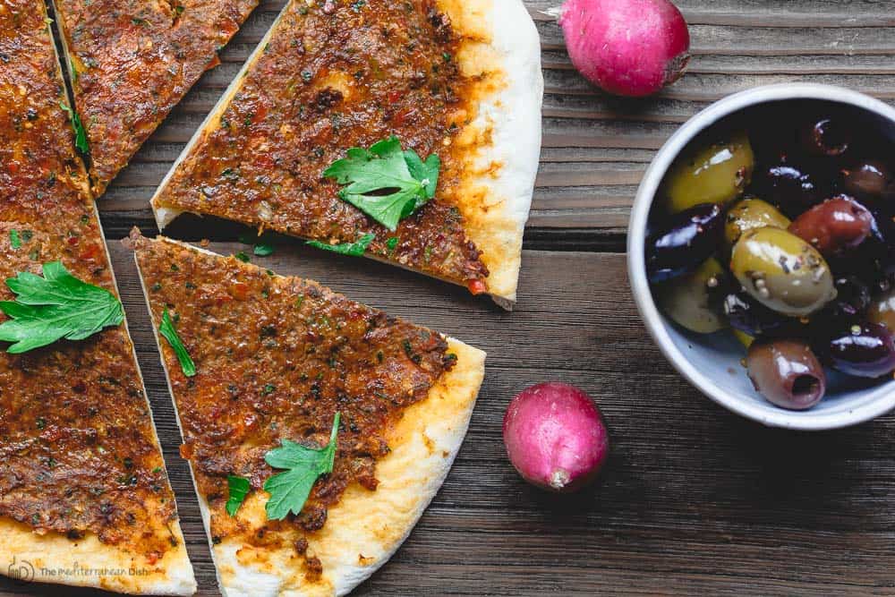 Sliced Turkish lahmacun (lahmajoun). To feed a crowd, slice it up and share with other mezze.