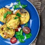 Mediterranean breakfast egg muffins served with tomatoes and feta