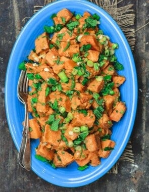 Simple Boiled Sweet Potatoes, tossed with fresh herbs, garlic, scallions and extra virgin olive oil