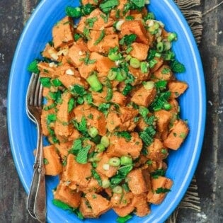 Simple Boiled Sweet Potatoes, tossed with fresh herbs, garlic, scallions and extra virgin olive oil