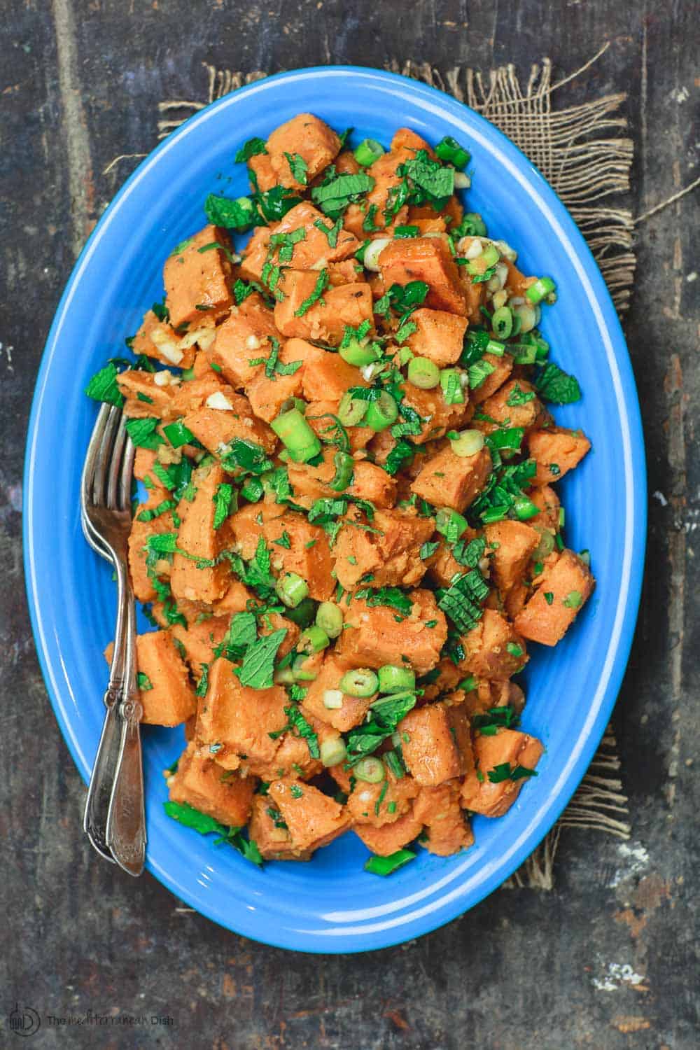 Simple Boiled Sweet Potatoes, tossed with fresh herbs, garlic, scallions and extra virgin olive oil