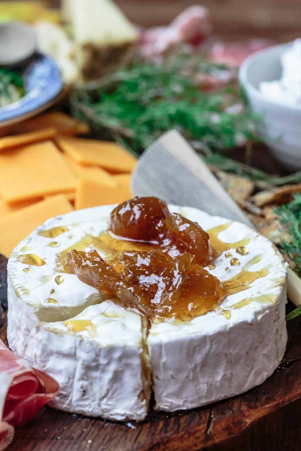 Brie cheese with fig jam, one side of a great cheese board